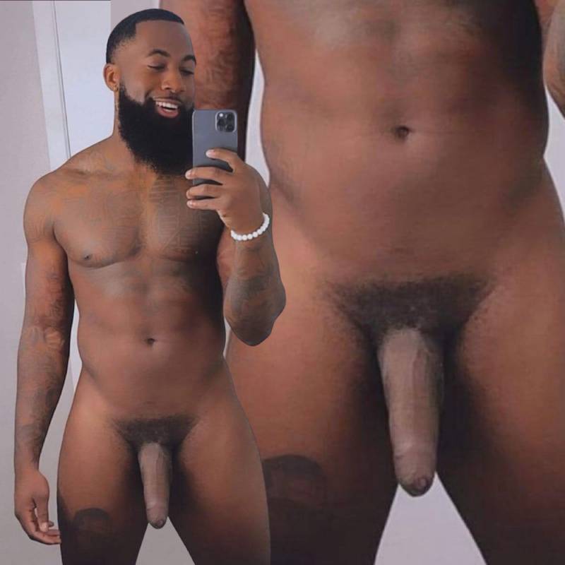 Uncut black shaft hanging low in photo